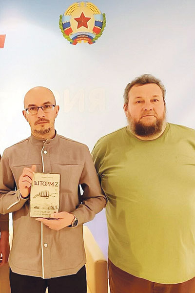 Даниил Туленков и Глеб Бобров на презентации в Луганске